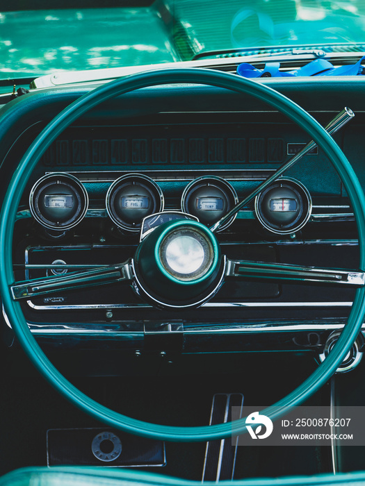 retro car dashboard interior. View of the steering wheel and dashboard of an old vintag car.