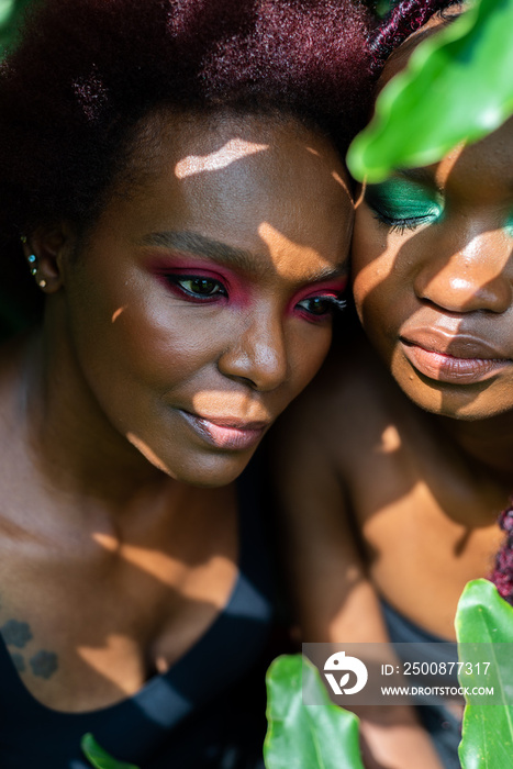 Portrait of two African women in leaves