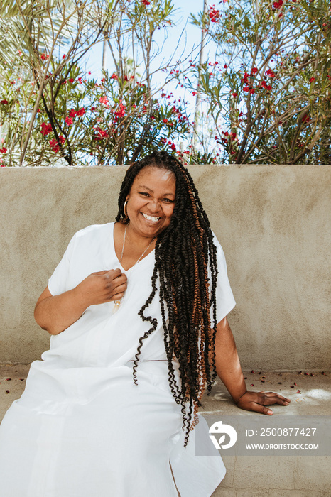 portrait of a plus size afro latinx haitian american woman smiling look at camera