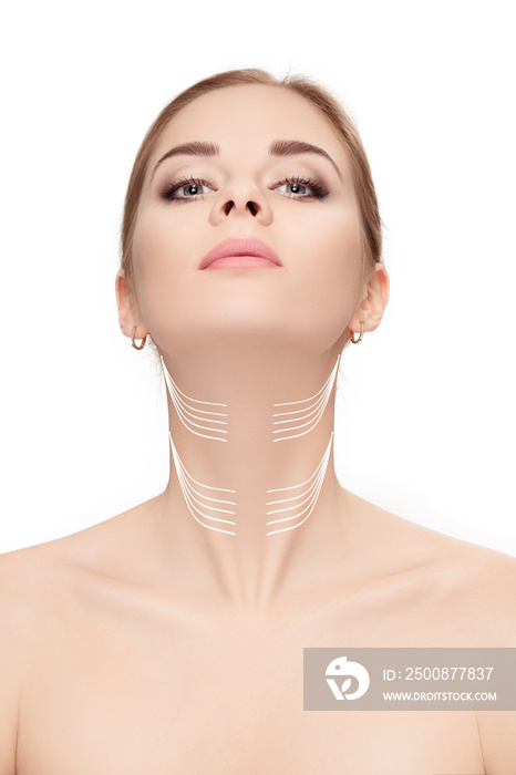 woman with arrows on face over white background. neck lifting co