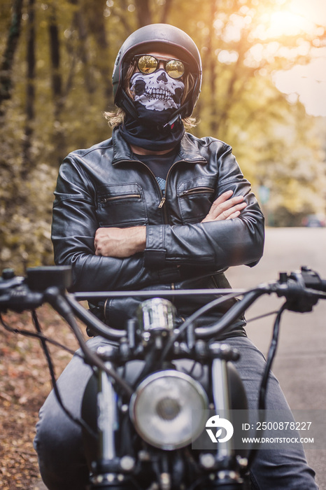 Biker man sitting on his motorcycle