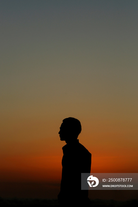 Silhouette of man at sunset