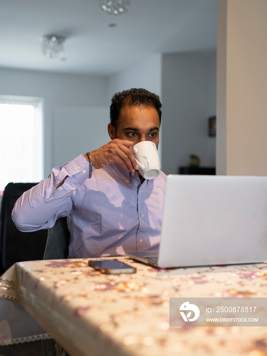 Man working on laptop from home