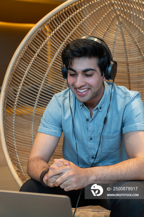 Young businessman during video call in office