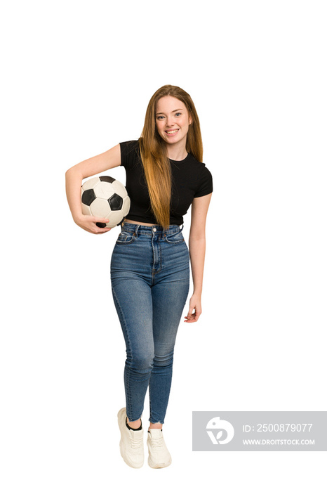Young redhead woman playing soccer cut out isolated