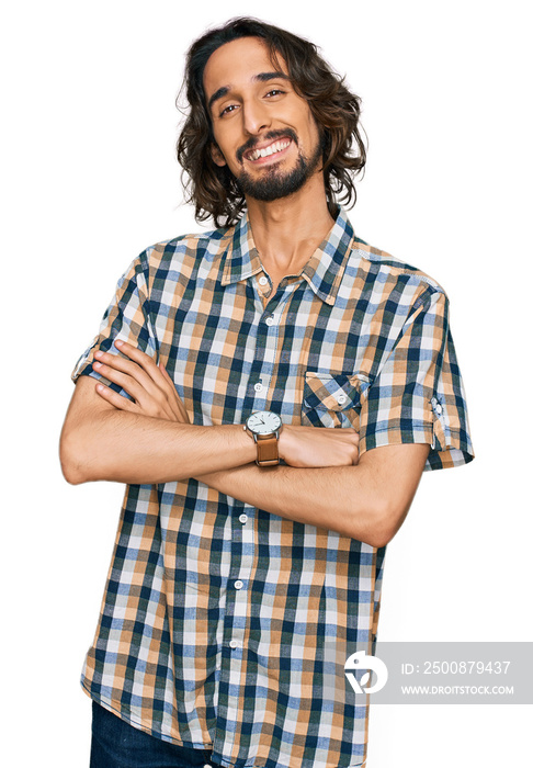 Young hispanic man wearing casual clothes happy face smiling with crossed arms looking at the camera. positive person.