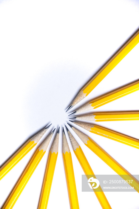 pencils in a half circle on white background