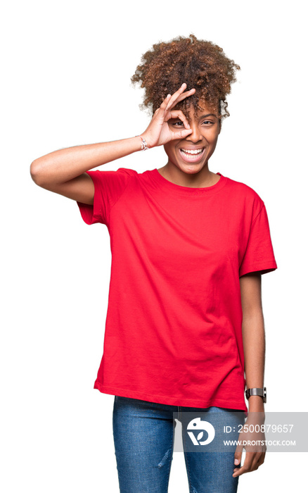 Beautiful young african american woman over isolated background doing ok gesture with hand smiling, eye looking through fingers with happy face.