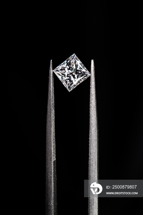 Princess cut diamond with tweezers