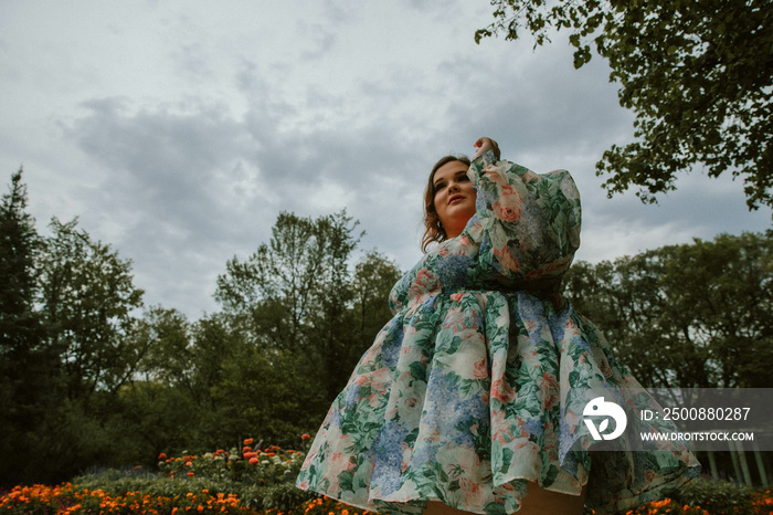 portrait of a plus size woman with floral dress