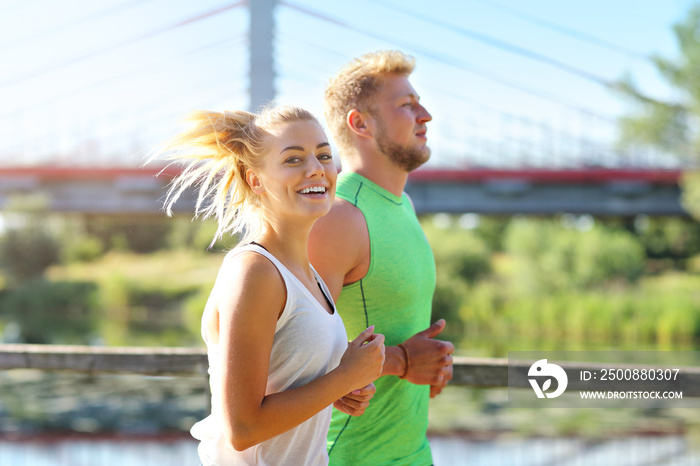 Young couple jogging in park