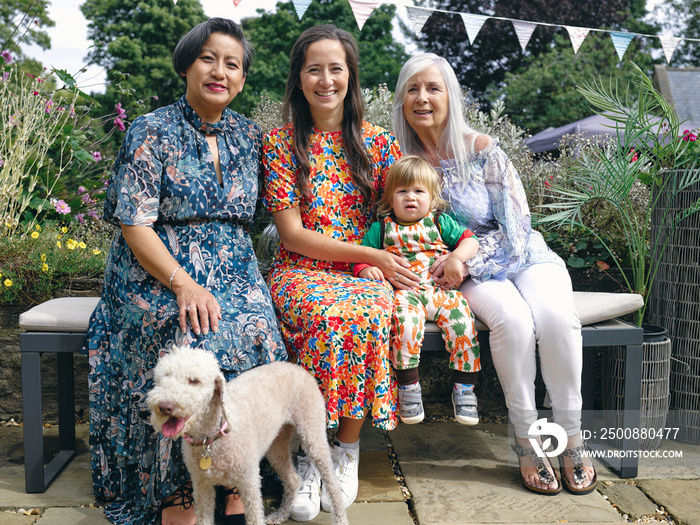 Portrait of multi-generation family with baby boy