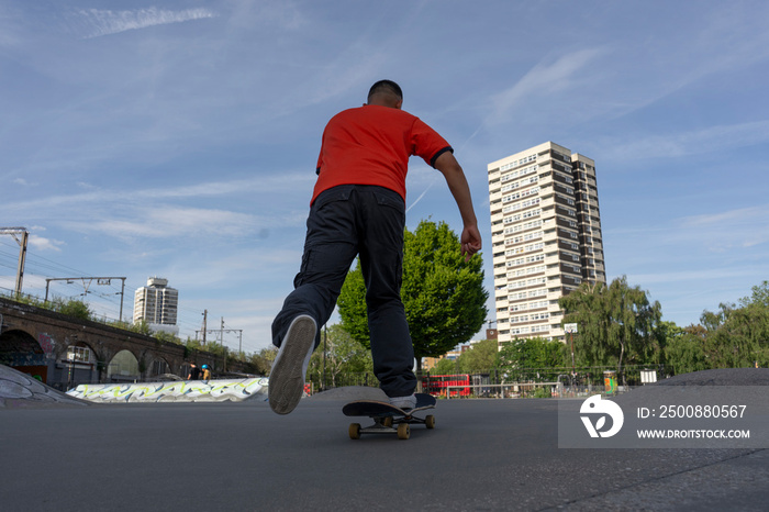 Young man skateboarding in skate park