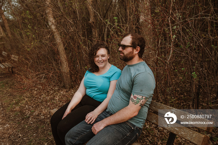 couple sits on bench