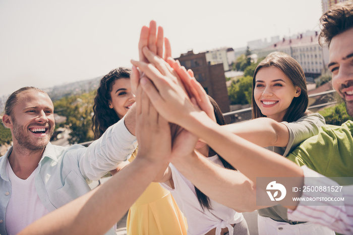 Photo of young cheerful good mood positive smiling happy successful good mood people best friend give high five each other on rooftop