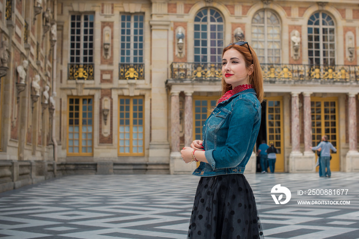 Holidays in Versailles, France. Fashionable pretty woman in trip, concept of vacation. Lady in romantic look outdoor