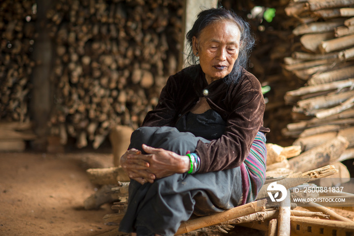 Senior woman in hut, Shan State, Keng Tung, Burma