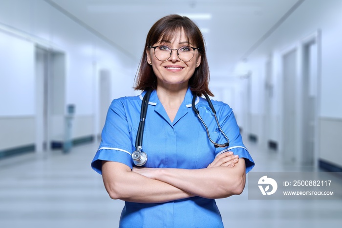 Portrait of confident female doctor in hospital