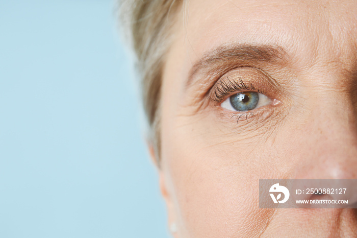 Portrait of mature woman on color background, closeup