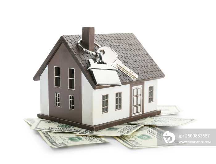 Figure of house, money and key on white background. Concept of buying real estate