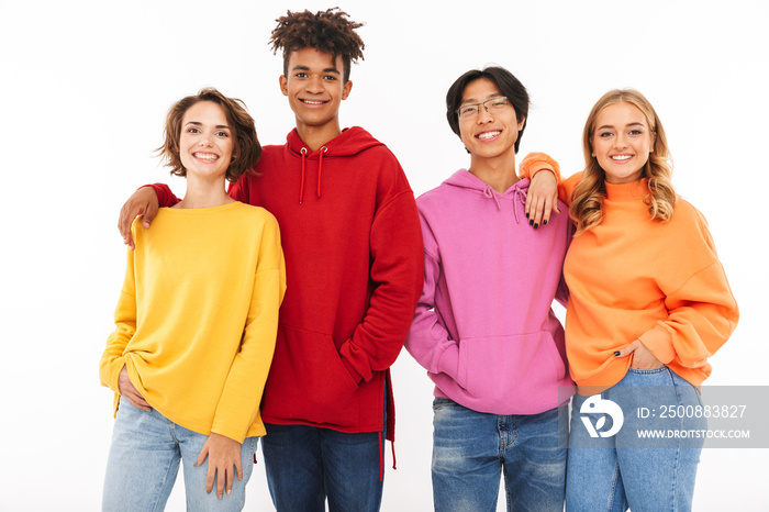 Group of cheerful multiracial friends standing isolated