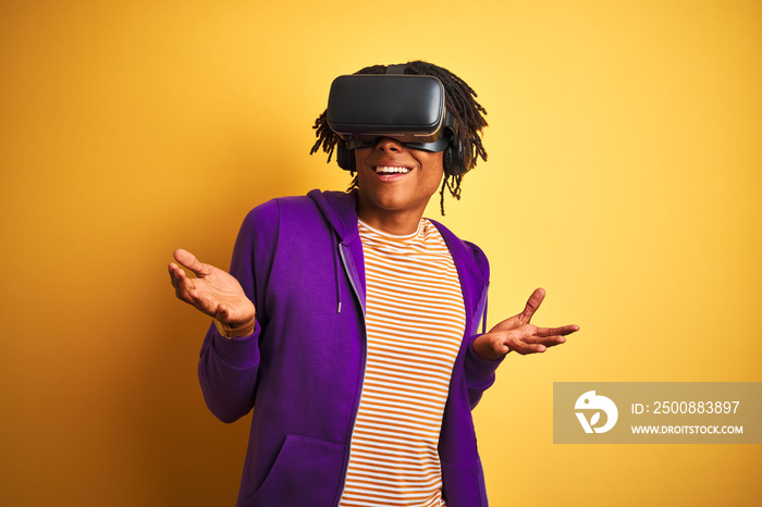 Young african american man playing virtual reality game using goggles