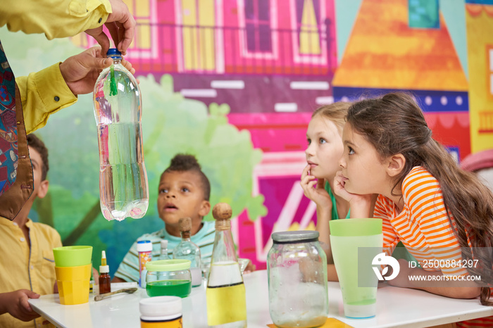 Happy kids on Birthday party show. Children having fun in entertainment center. Happy childhood concept.