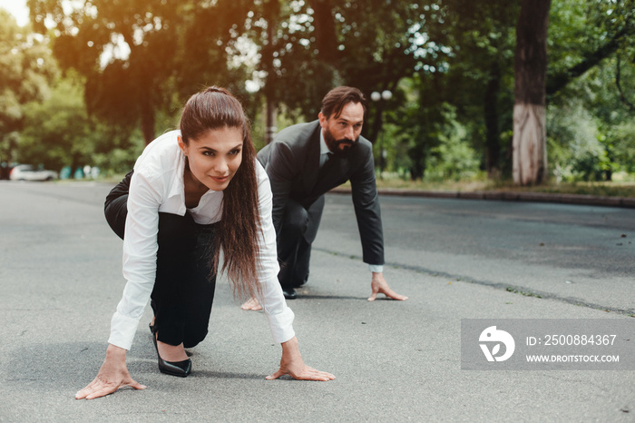 Male and female colleague starting to run. Business sprinters. Fight of genders concept.