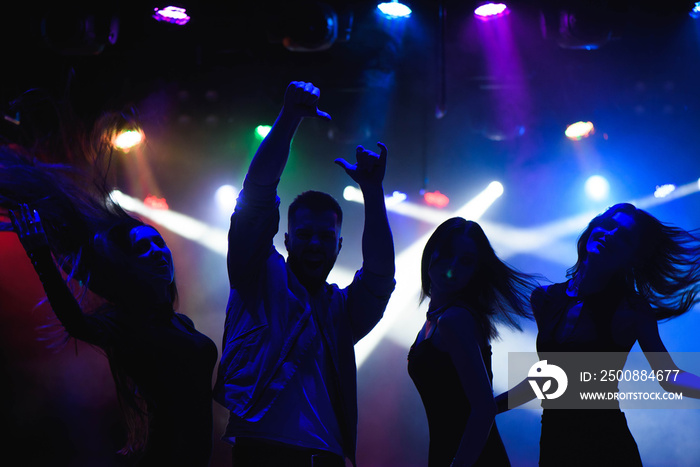 party, holidays, celebration, nightlife and people concept - group of happy friends dancing in night club