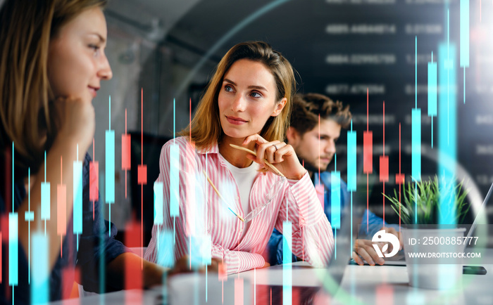 Group of business people working at modern office.Technical price graph and indicator, red and blue candlestick chart and stock trading computer screen background. Double exposure. Traders at work