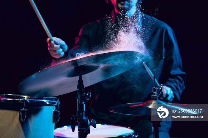 Drummer’s rehearsing on drums before rock concert. Man recording music on drumset in studio