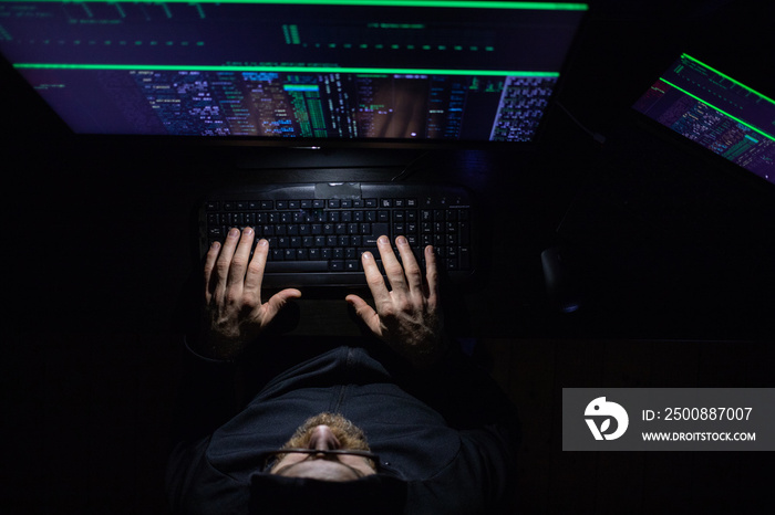 hacker coding at night cybersecurity concept