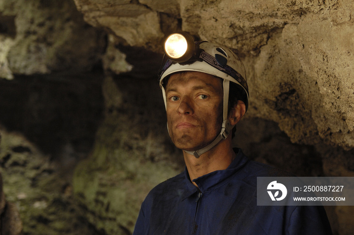 portrait of a miner inside a mine