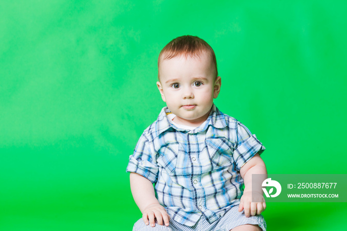 Portrait of a small baby boy, looking at the camera