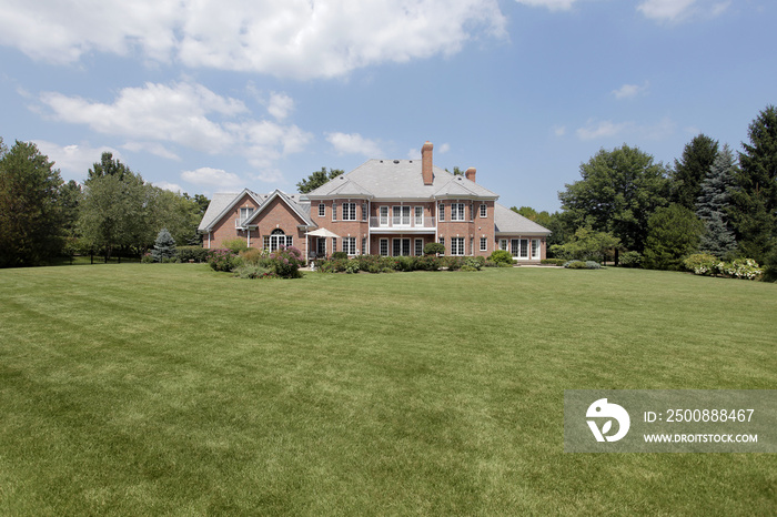 Rear view of luxury brick home