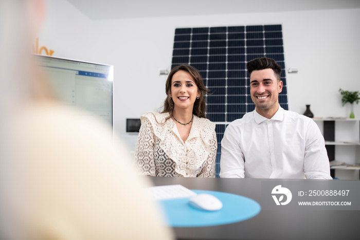 couple in an establishment decide on buying solar panels for their home