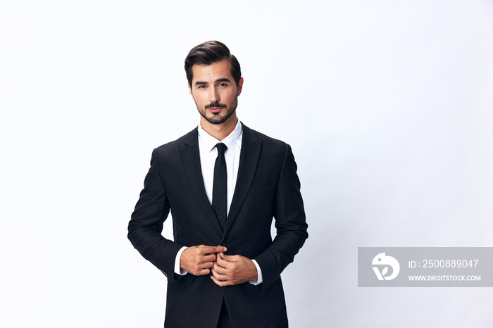 Portrait of a man in an expensive business suit on a white background isolated, copy space. Businessman startup technology