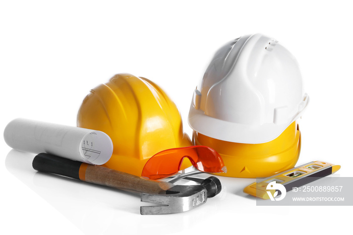 Construction drawing with tools and helmets isolated on white