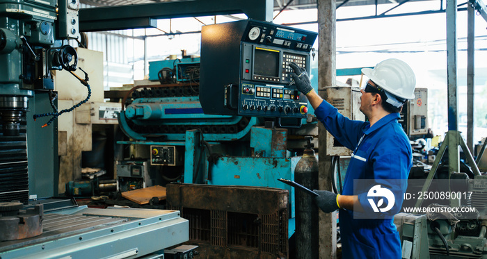 Engineer,Industry and construction concept. Portrait of caucasian Industry factory maintenance engineer wearing uniform and safety helmet in factory.