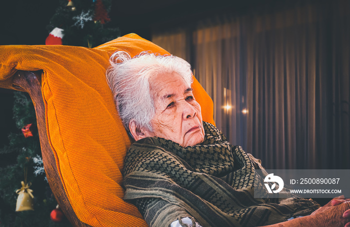 Asian old woman Celebrate the New Year and Christmas alone.