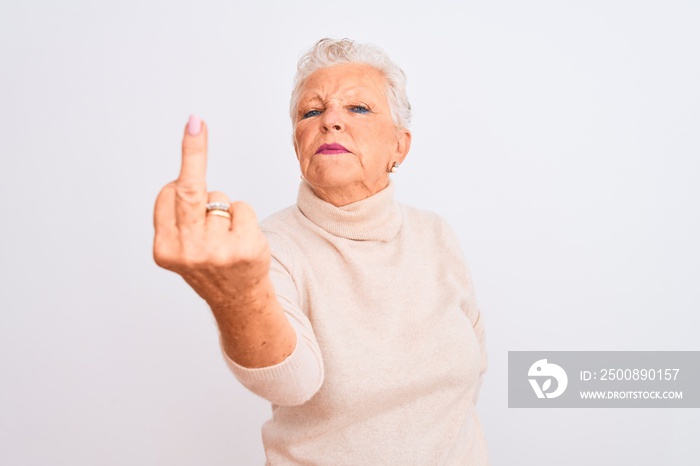 Senior grey-haired woman wearing turtleneck sweater standing over isolated white background Showing middle finger, impolite and rude fuck off expression