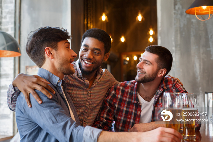 Old friends meeting in pub, drinking beer