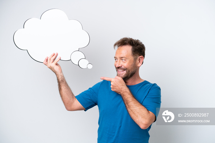 Middle age caucasian man isolated on white background holding a thinking speech bubble and pointing it