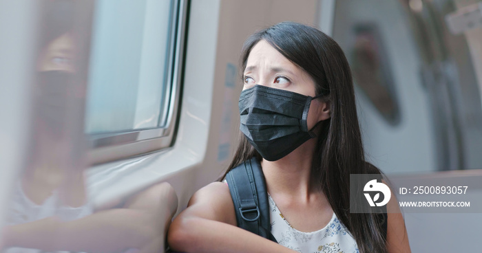 Woman wearing mask and take the train in Taipei city