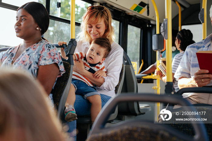 Mom and boy in public transport