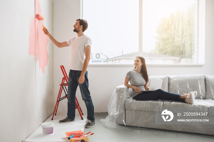 Young couple doing apartment repair together themselves