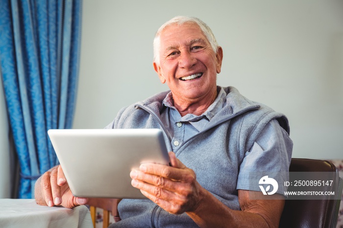 Senior man using a digital tablet