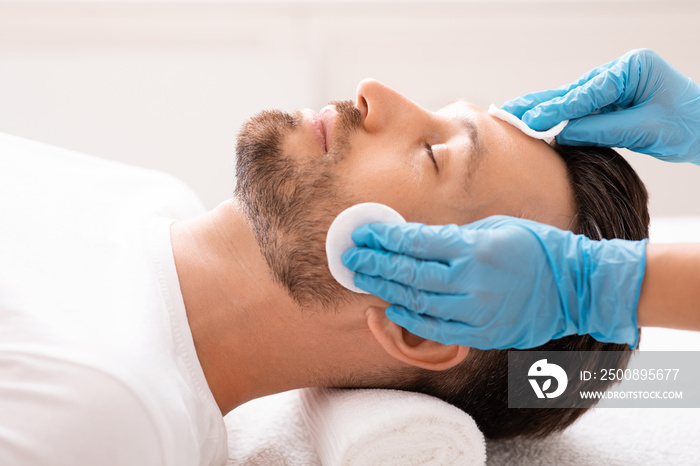 Middle aged man visiting beauty clinic, face care concept