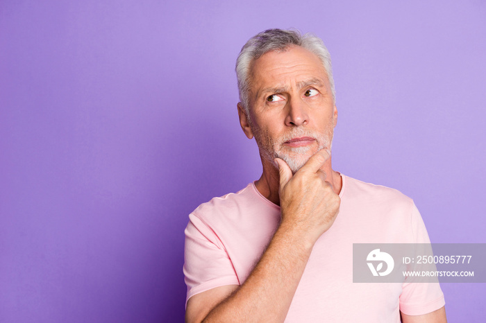 Photo of retired grandfather arm chin thoughtful look empty space wear pink t-shirt isolated purple color background