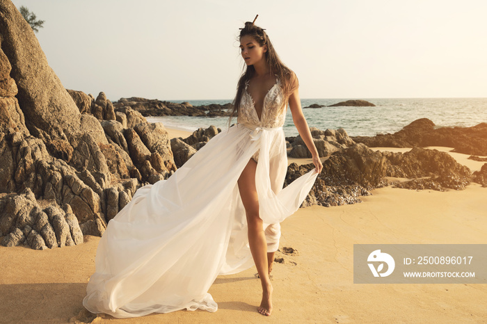 Young and beautiful bride on the beach